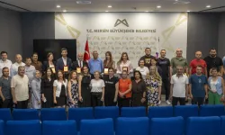Mersin Büyükşehir’de görevde yükselen 22 personele plaket takdimi